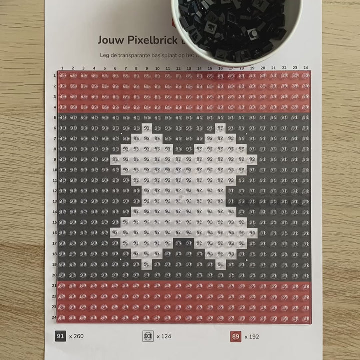 Process of placing bricks into best Amsterdam souvenir - Amsterdam flag in bricks